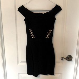 Black off the shoulder bandage dress with gold detailing